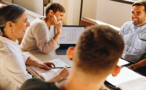 A group of people developing sales plans.
