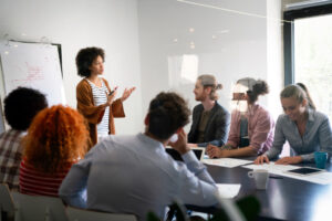 Young businesswoman leading a discussion during a meeting with her colleagues.